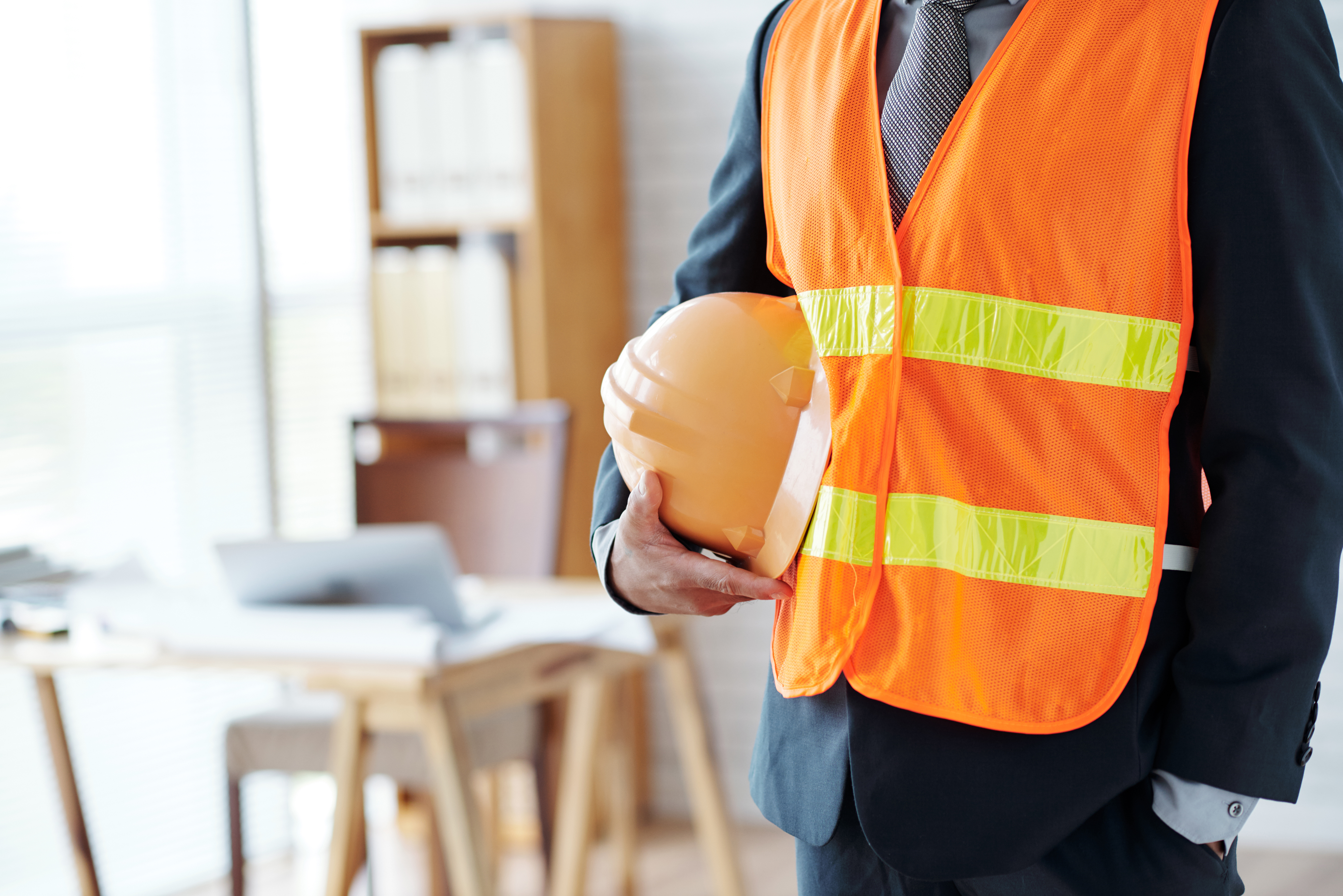 unrecognizable-male-construction-industry-executive-posing-safety-vest-with-hardhat.jpg